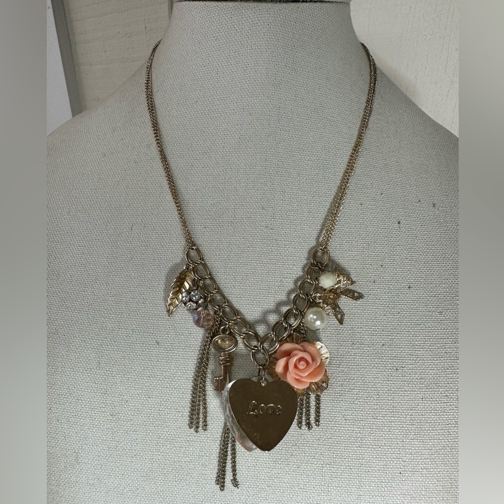 Goldtone dangling charm style necklace